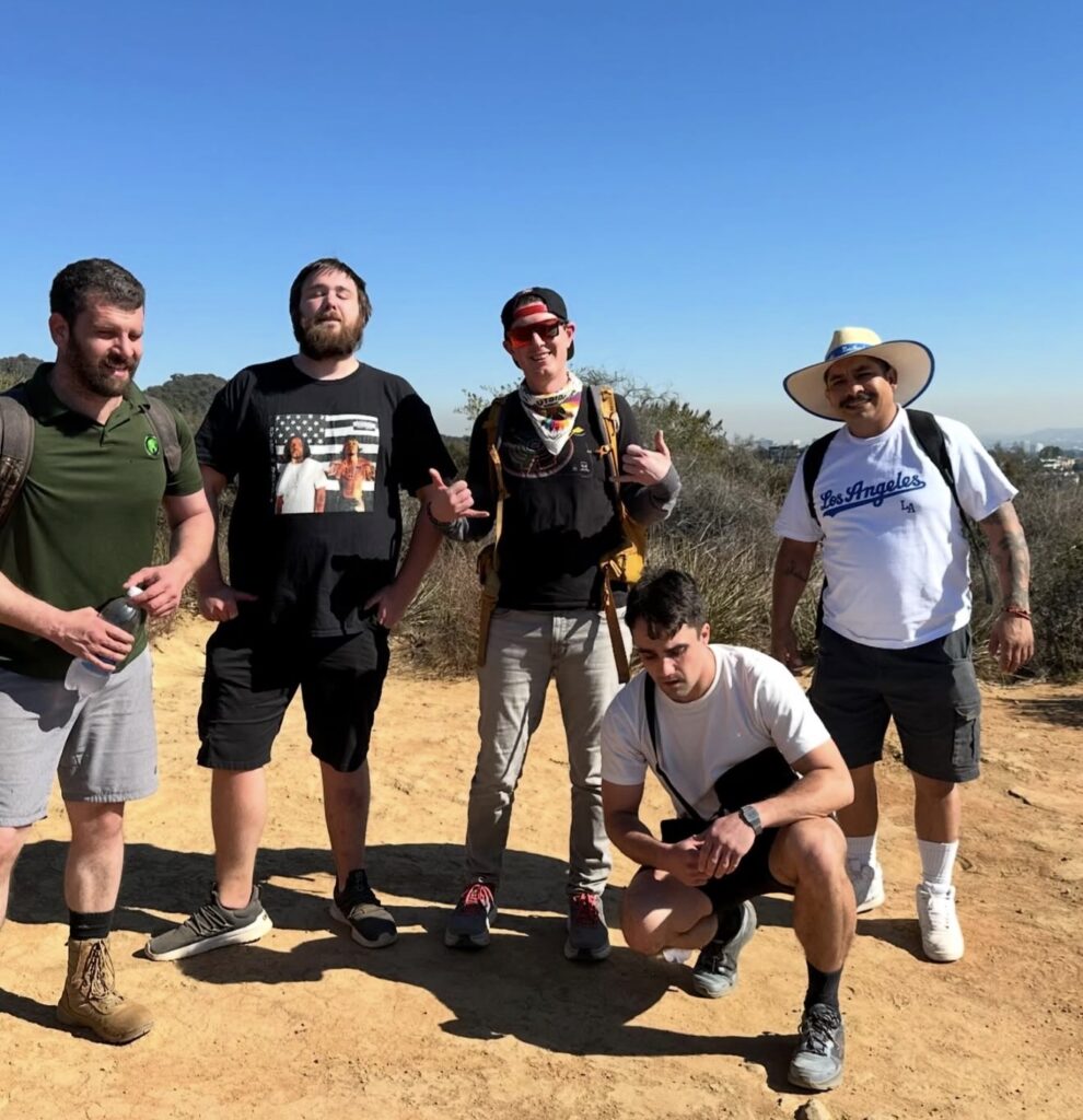 Group of residents at Living Now sober living hiking together.